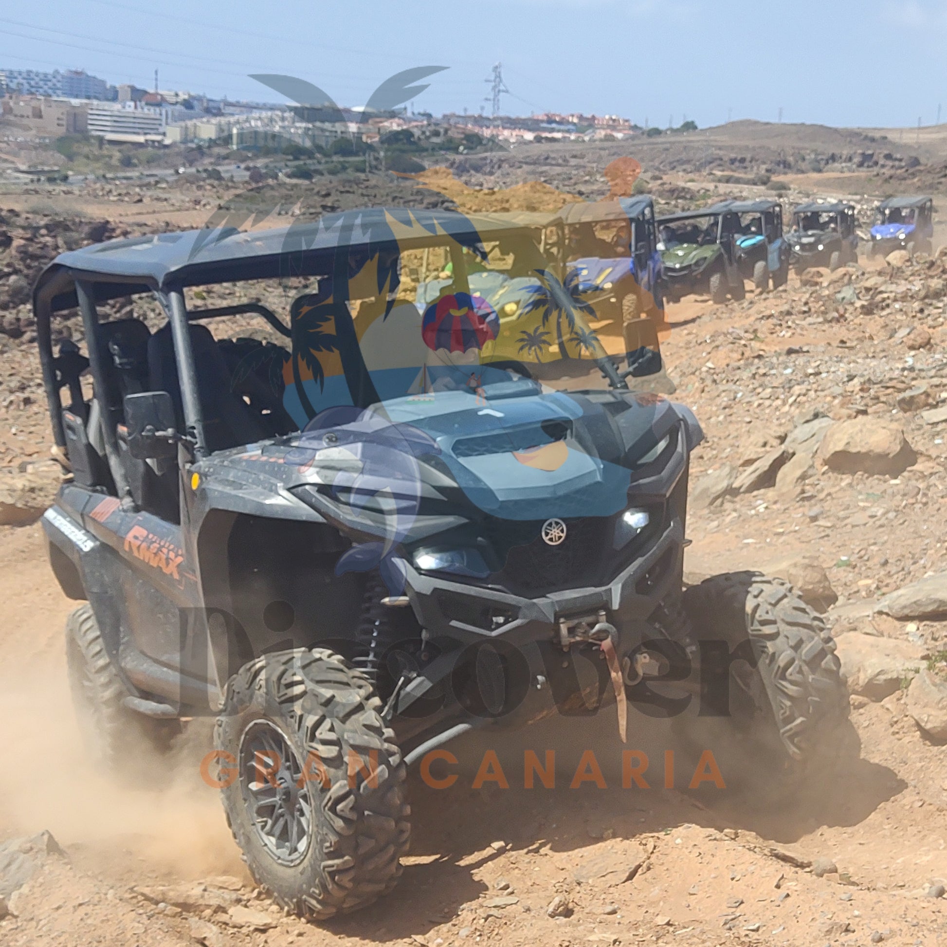 Driving a buggy in gran canaria, on a dirt track with 'Gran Canaria' branding.