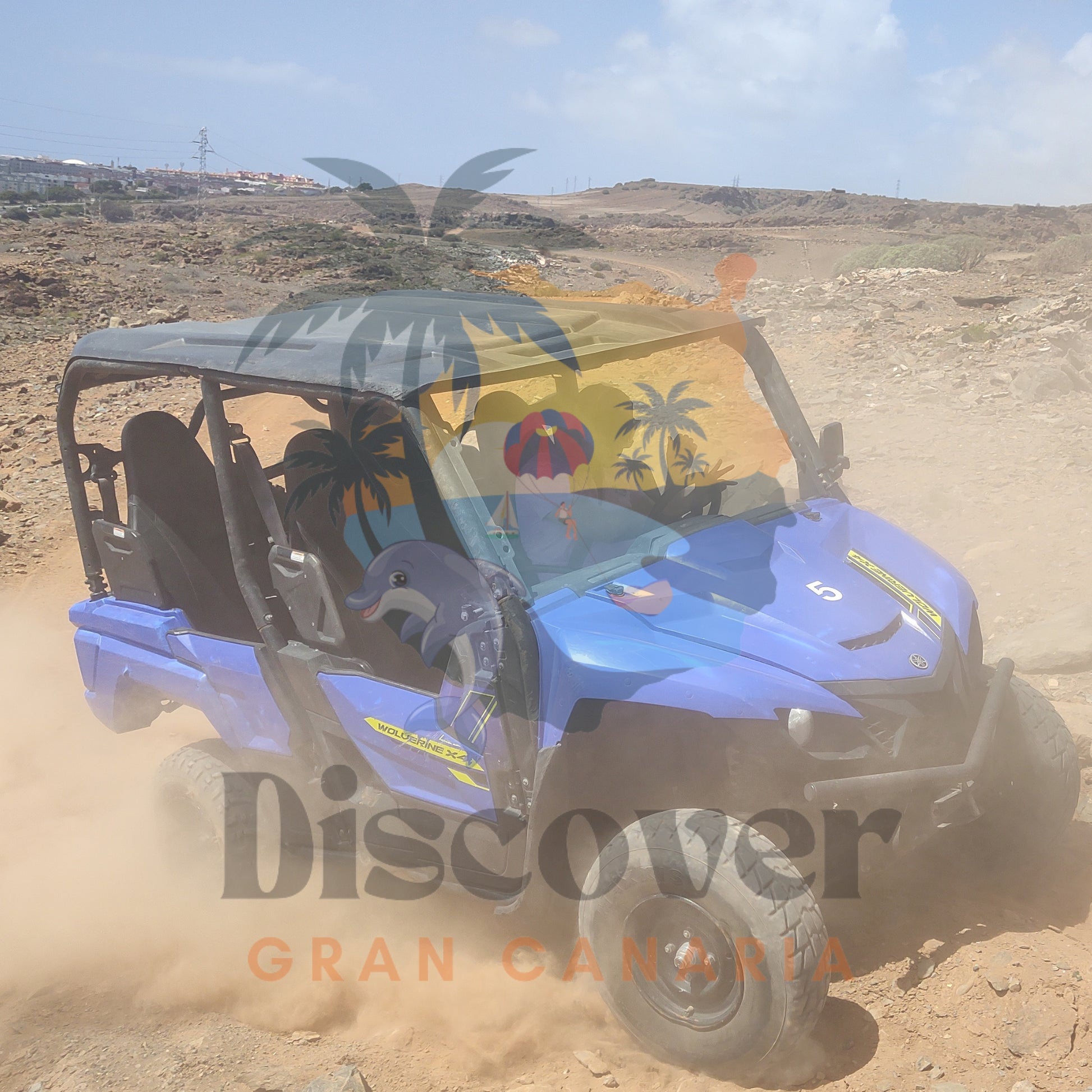 Blue off-road buggy driving on a dirt track with 'Discover Gran Canaria' branding.