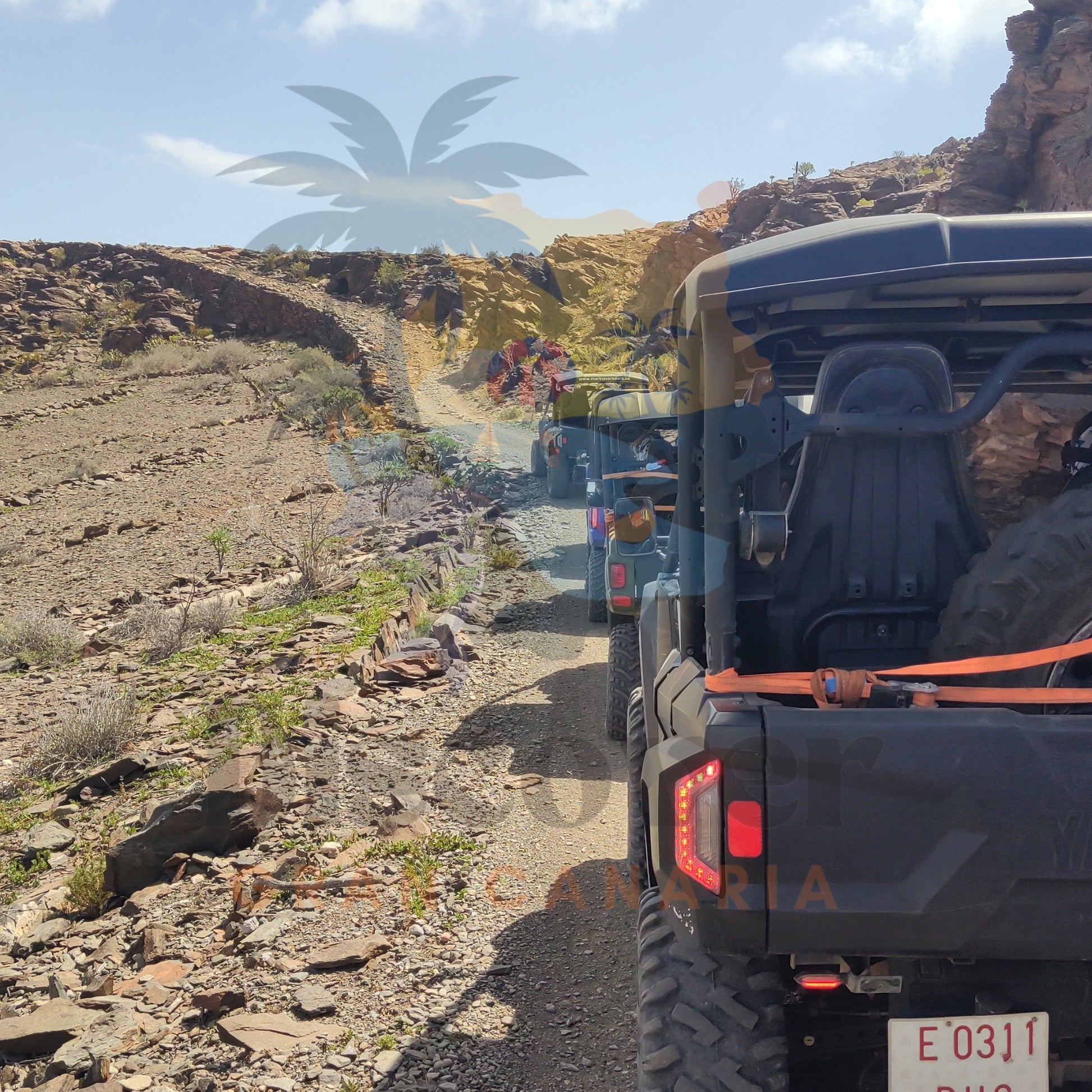 Row of off-road buggy vehicles on a rocky desert in Gran Canaria