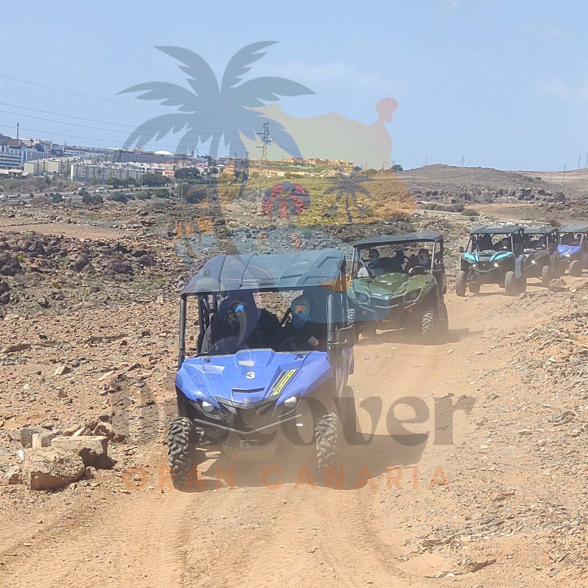 Blue off-road buggy on a dirt track with 'Buggies Canaria' branding.