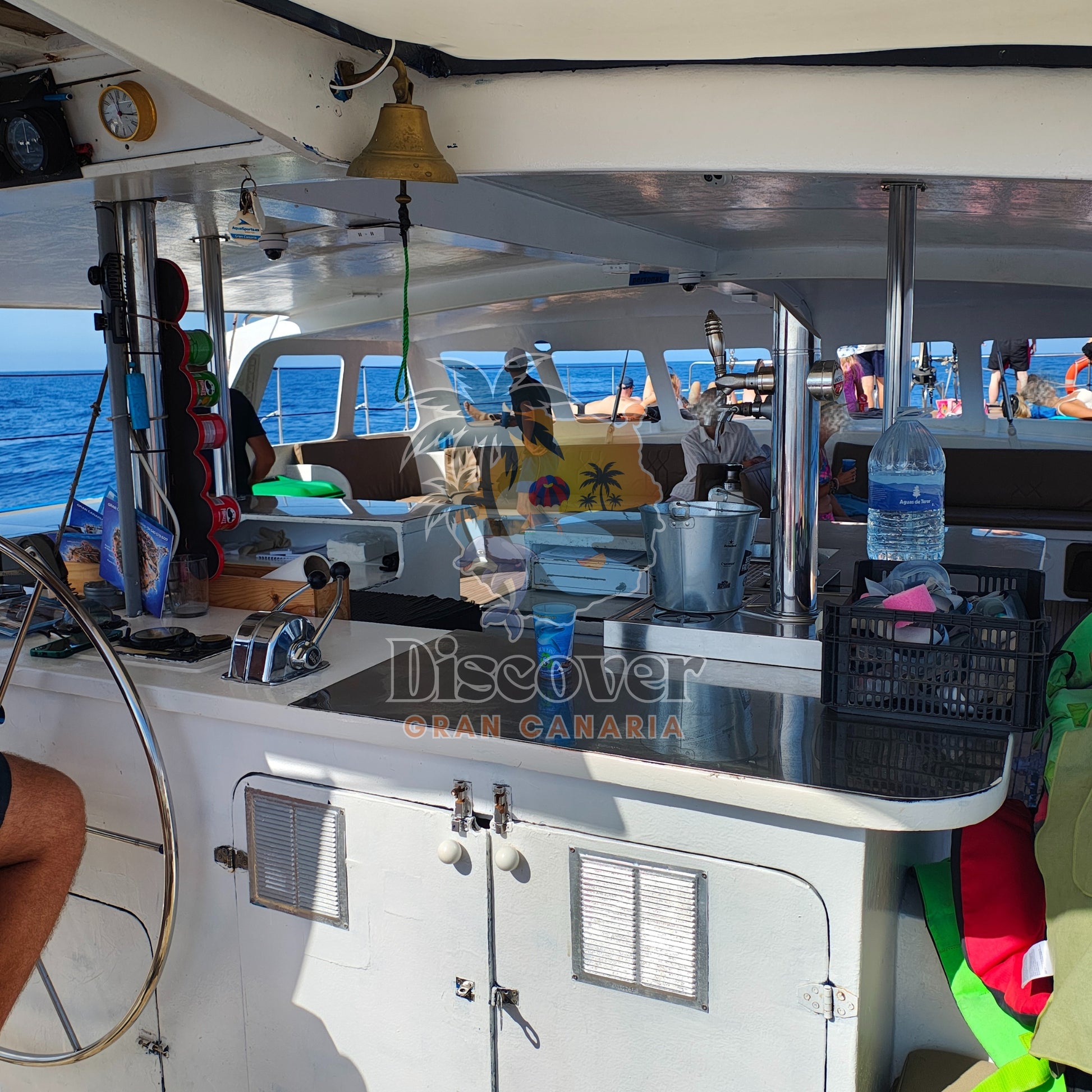 Interior of a boat with a counter and 'Discover Gran Canaria' branding.