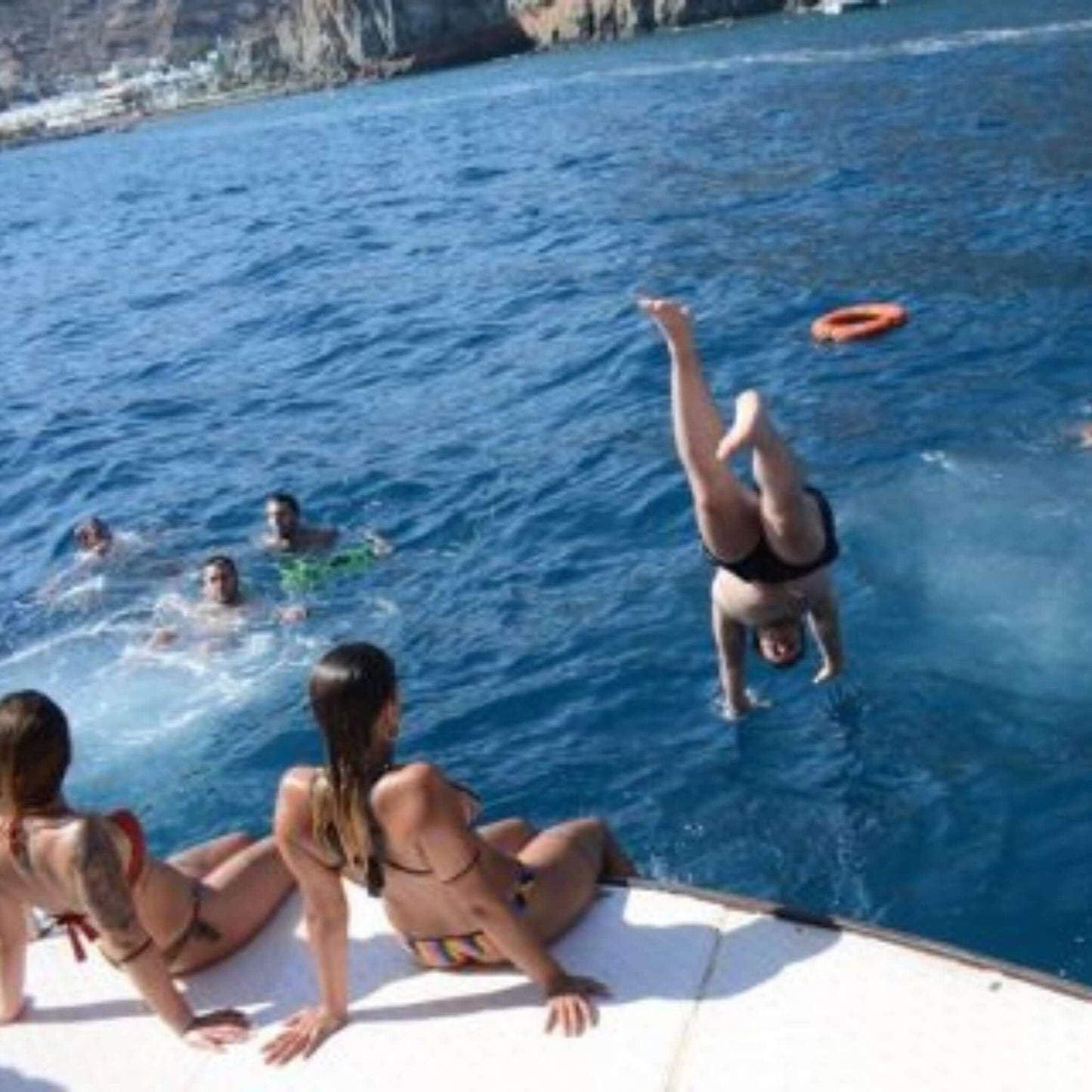 supercat - swim stop and people jumping from the boat inside the ocean