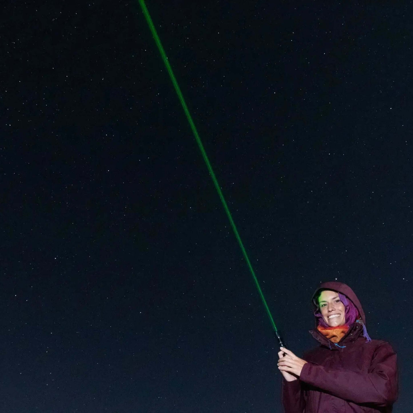 A person using a green laser pointer to guide during the Sunset & Stargazing Tour in Gran Canaria.