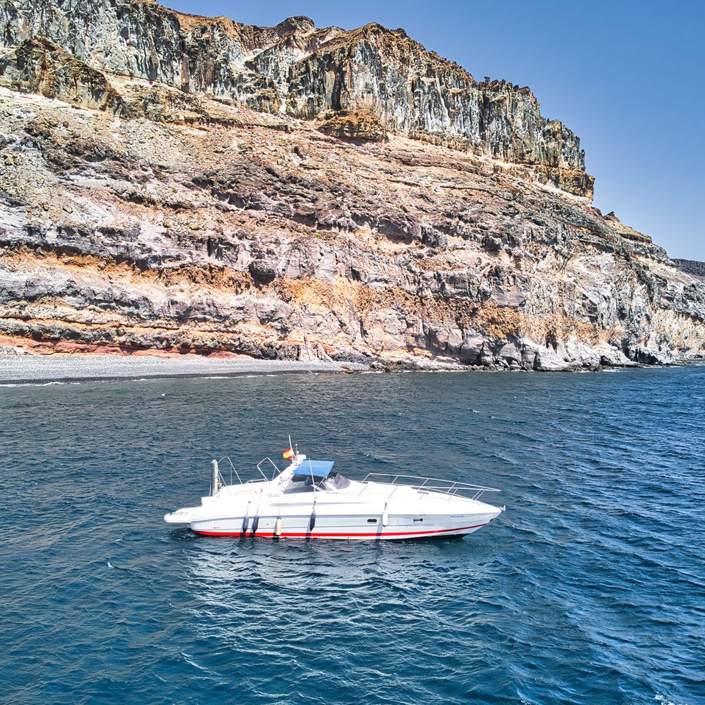 Gui Gui Yacht Tour Gran Canaria | Private & Shared Cruise - luxury yacht on water near cliffs in Gran Canaria