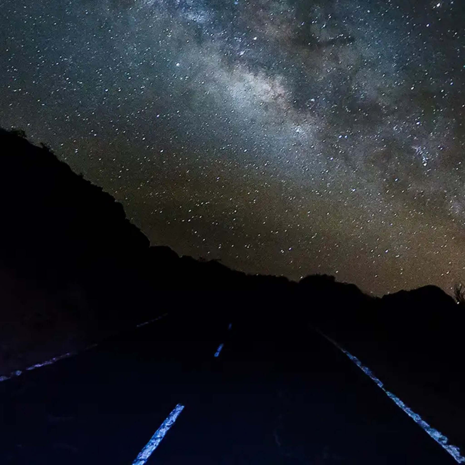 Starlit sky above a dark road during the Sunset & Stargazing Tour in Gran Canaria.
