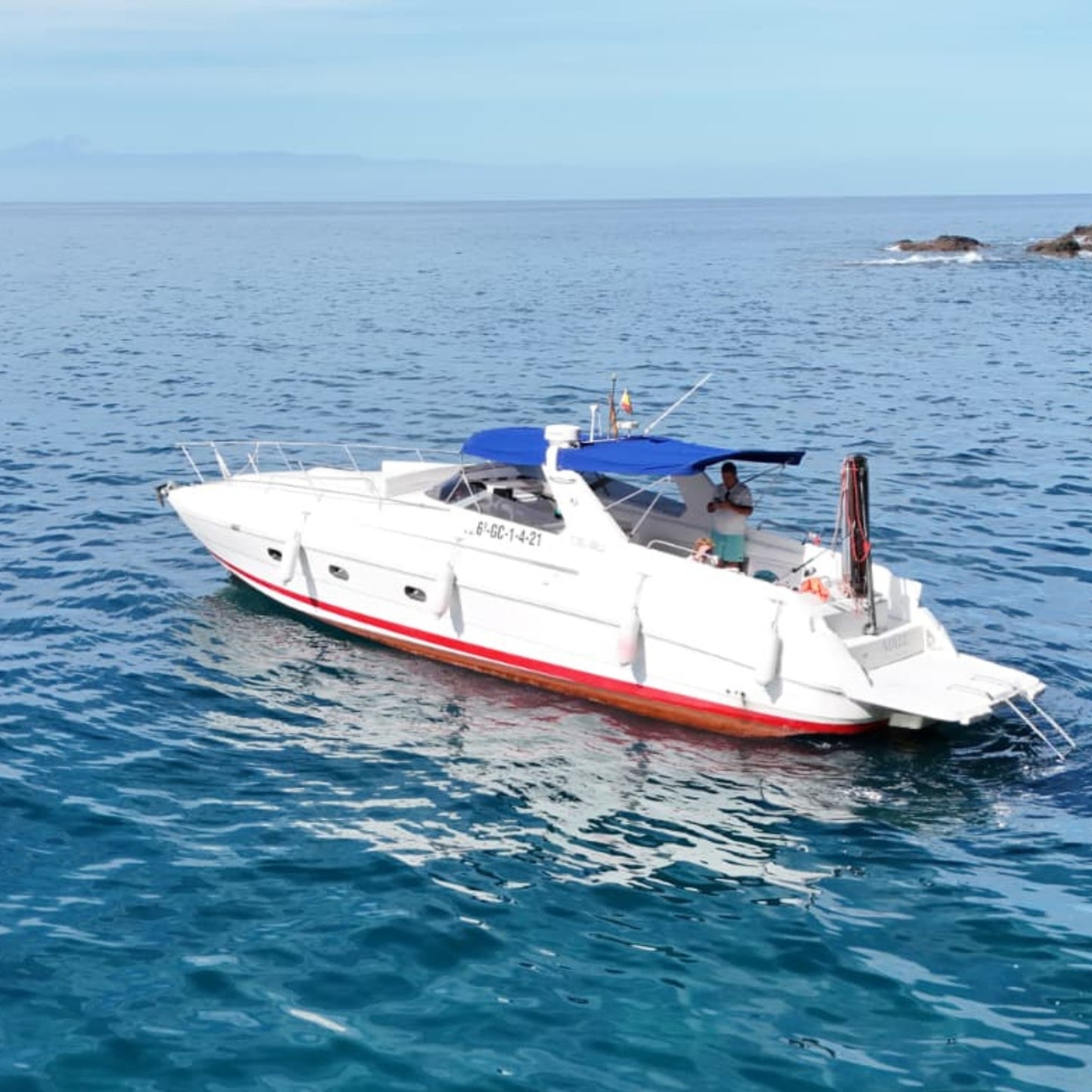 Gui Gui Yacht Tour Gran Canaria | Private & Shared Cruise on a luxury boat in clear blue waters.