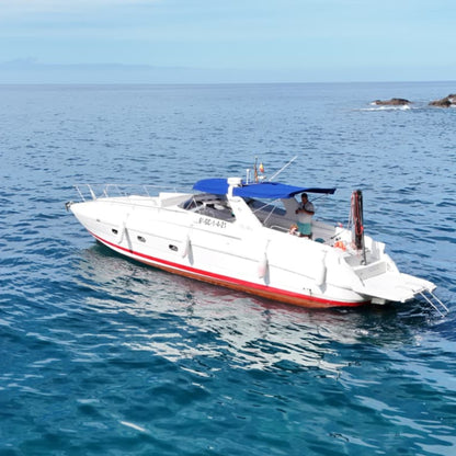 Gui Gui Yacht Tour Gran Canaria | Private & Shared Cruise on a luxury boat in clear blue waters.