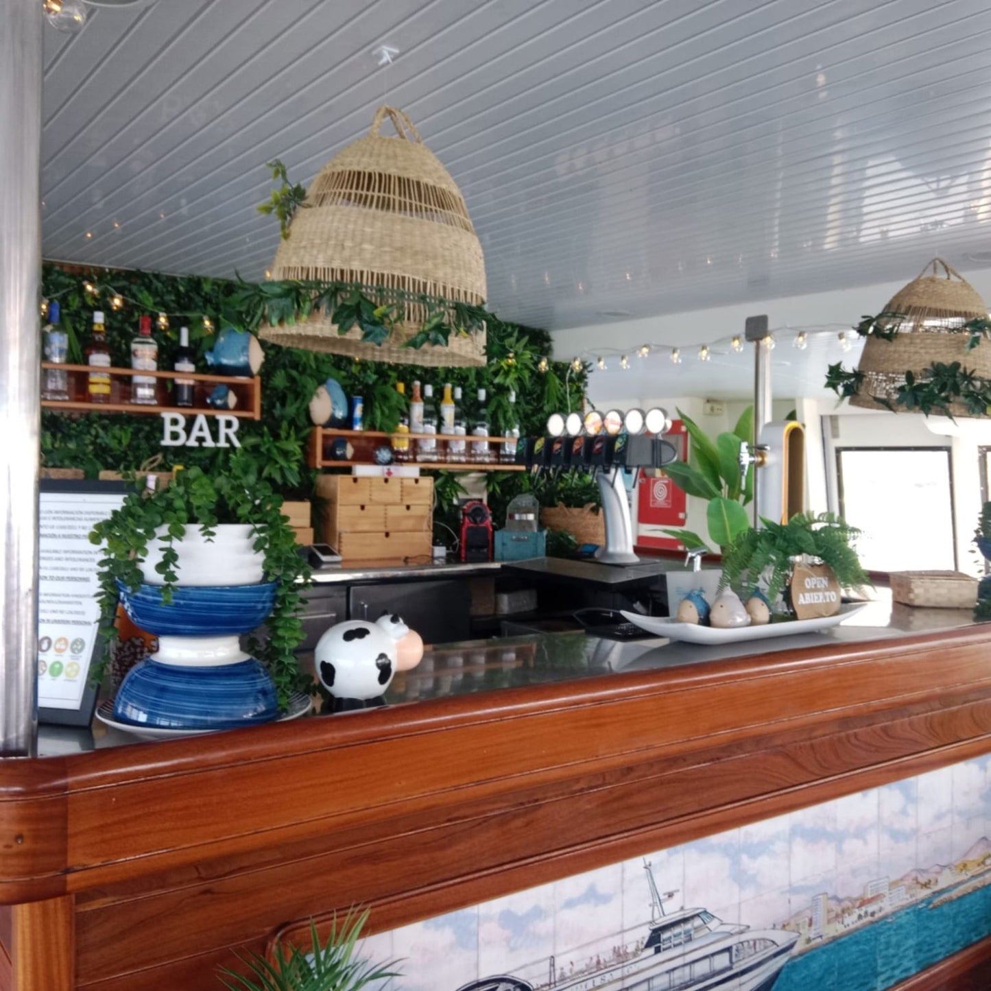 Princesa Ico All Inclusive Boat Trip Gran Canaria bar area with greenery and drinks.