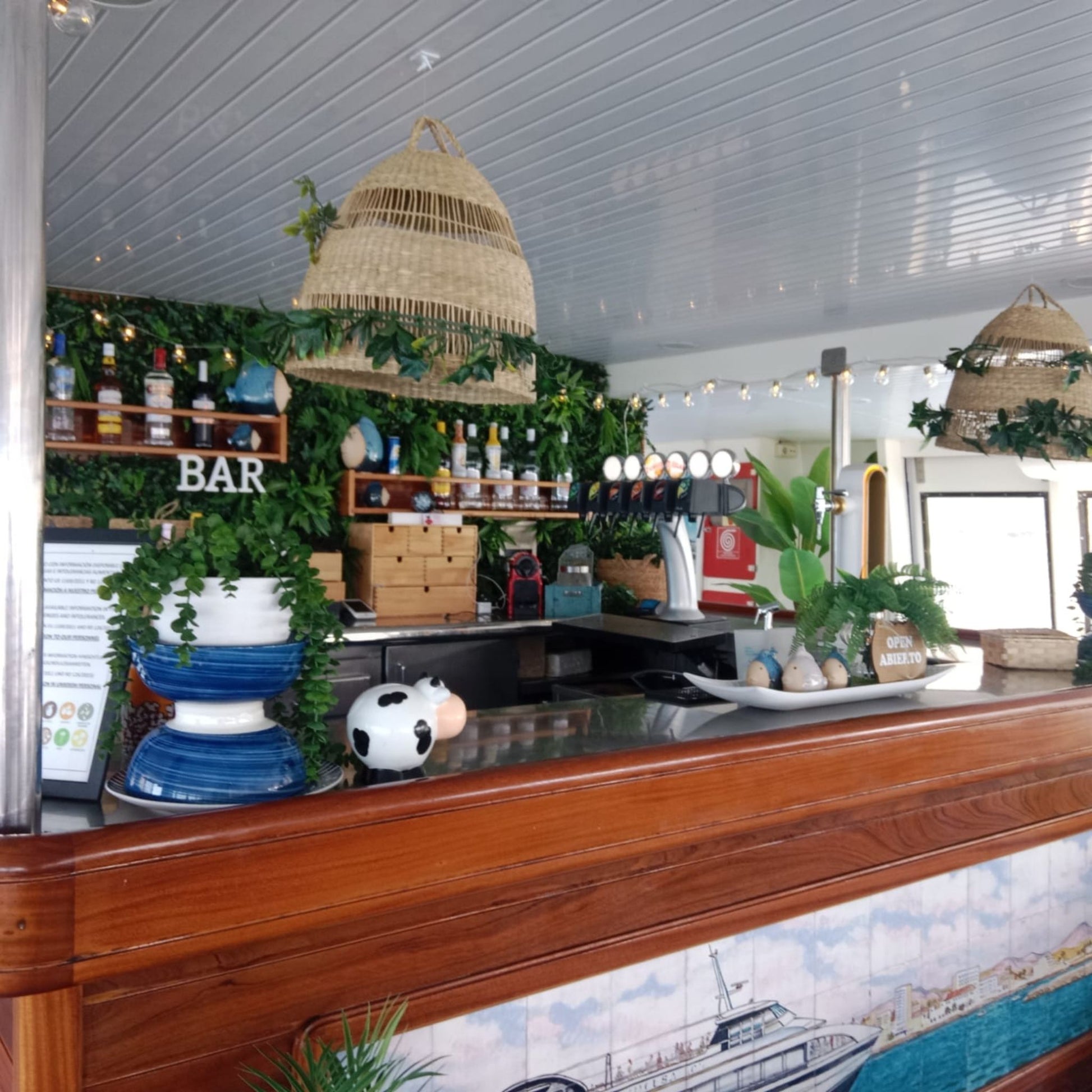 Princesa Ico All Inclusive Boat Trip Gran Canaria bar area with greenery and drinks.