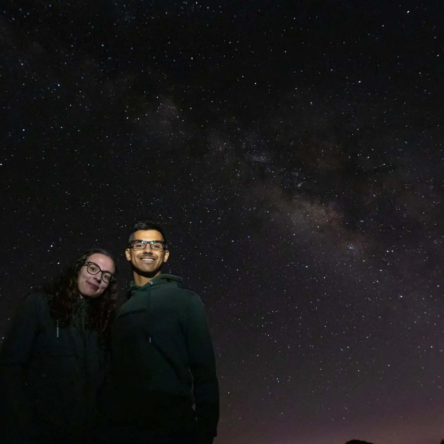Couple enjoying the night sky during a Sunset & Stargazing Tour in Gran Canaria with stars above.