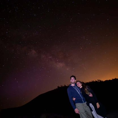Couple enjoying the night sky during the Sunset & Stargazing Tour in Gran Canaria.